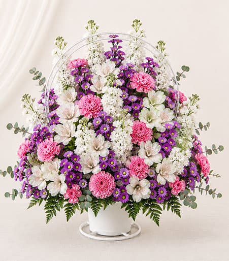 Mixed flowers in a handled basket